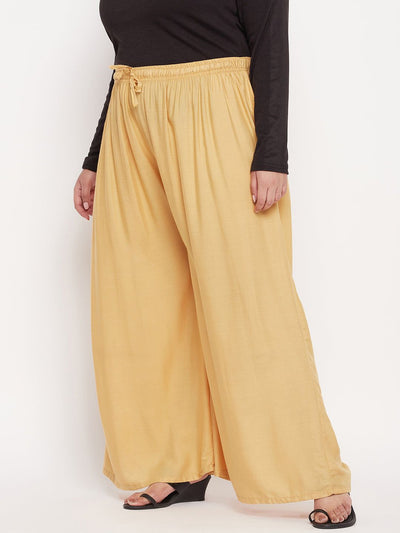 Fawn solid rayon jumbo sharara with elasticated waistband and drawstring.