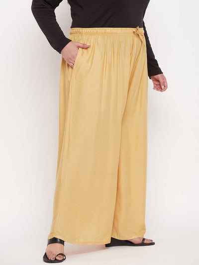 Fawn solid rayon jumbo sharara with elasticated waistband and drawstring.