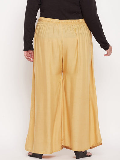Fawn solid rayon jumbo sharara with elasticated waistband and drawstring.