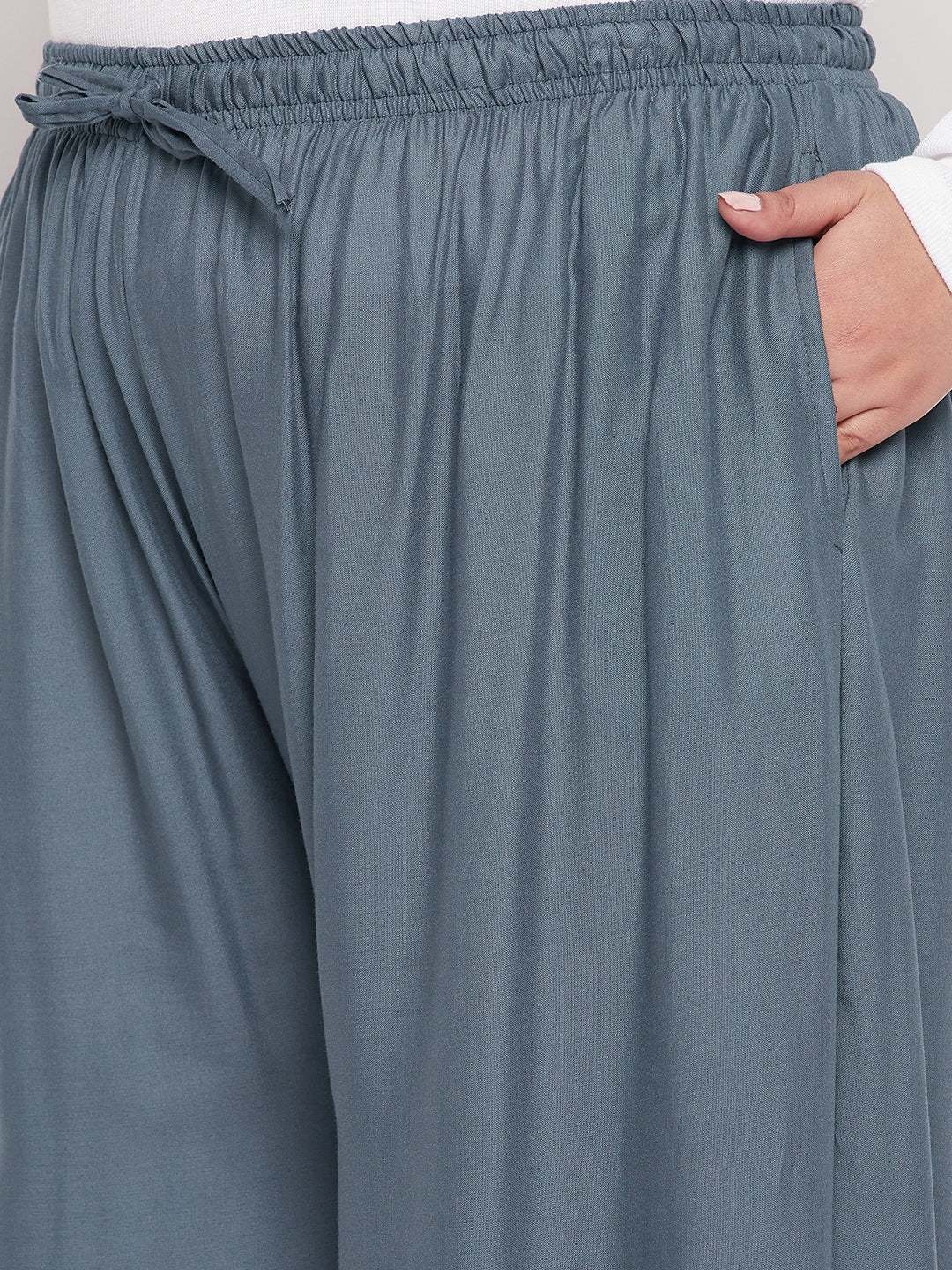 Grey solid rayon jumbo sharara with elasticated waistband and drawstring.