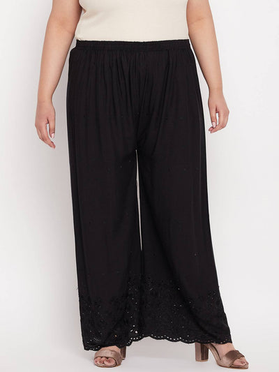Black embroidered rayon palazzo with chikankari design and elasticated waistband.