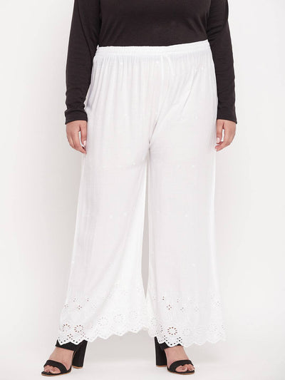 White embroidered rayon palazzo with elasticated waistband and drawstring.