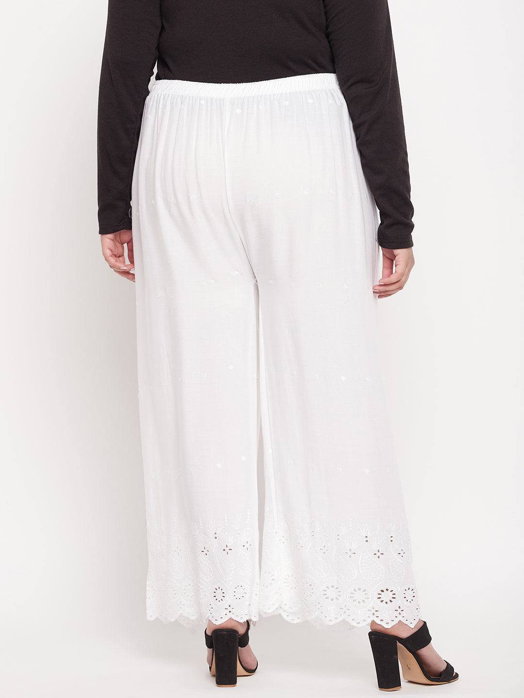 White embroidered rayon palazzo with elasticated waistband and drawstring.