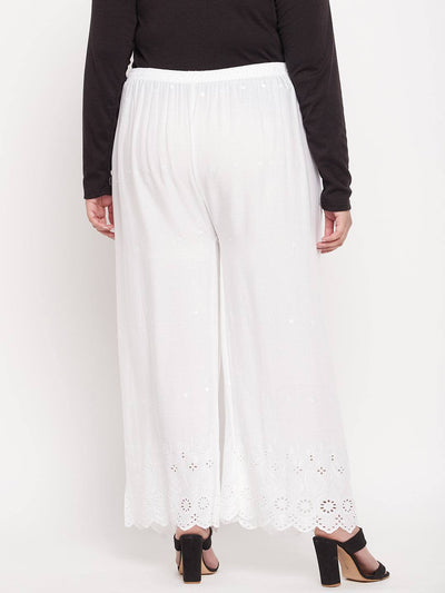 White embroidered rayon palazzo with elasticated waistband and drawstring.