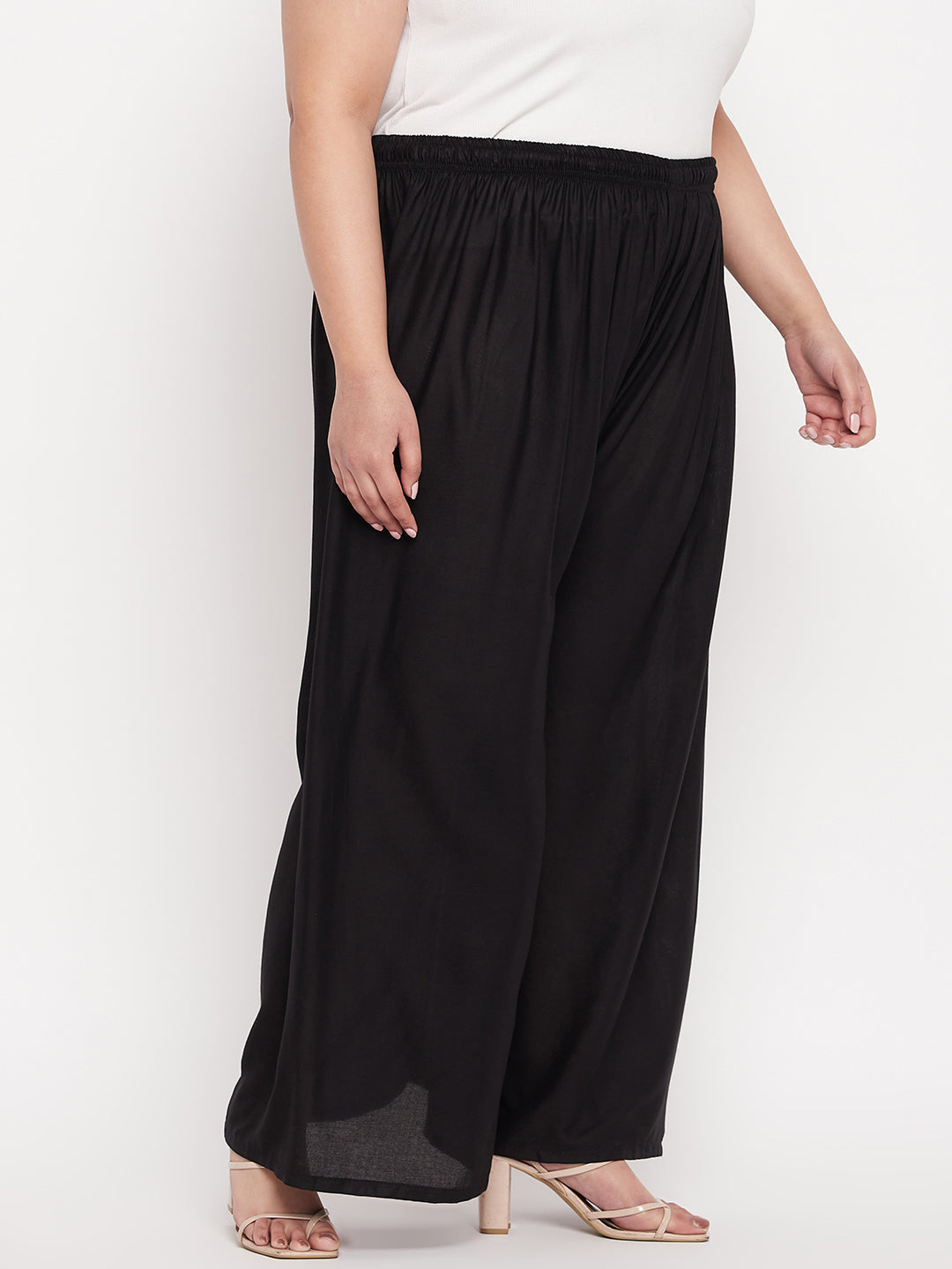 Black solid rayon palazzo with elasticated waistband and drawstring.