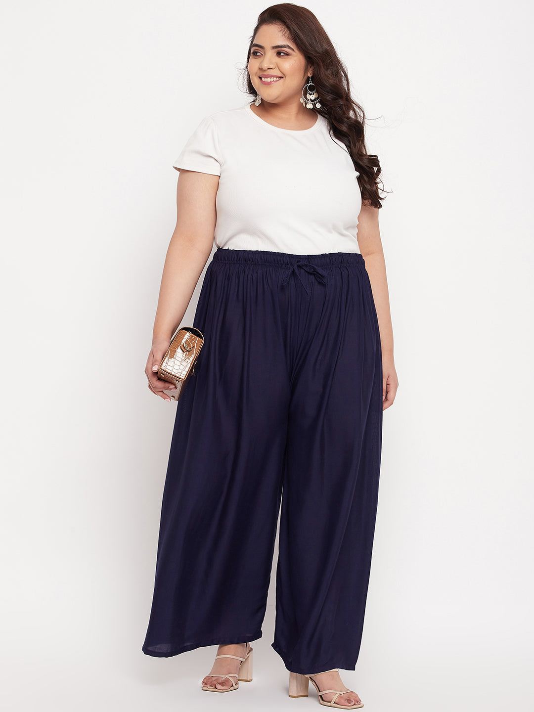 Navy blue solid rayon palazzo with elasticated waistband and drawstring.