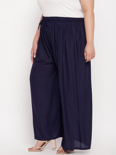 Navy blue solid rayon straight palazzo with elasticated waistband and drawstring.