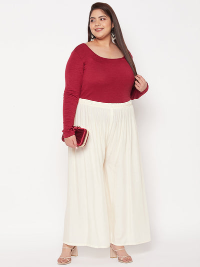 Off-white solid rayon palazzo with elasticated waistband and drawstring.