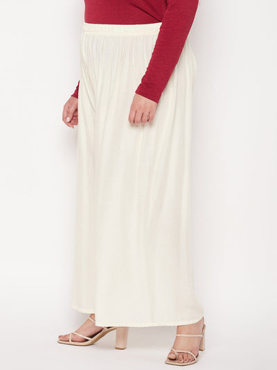 Off-White Solid Rayon Palazzo with elasticated waistband and drawstring.