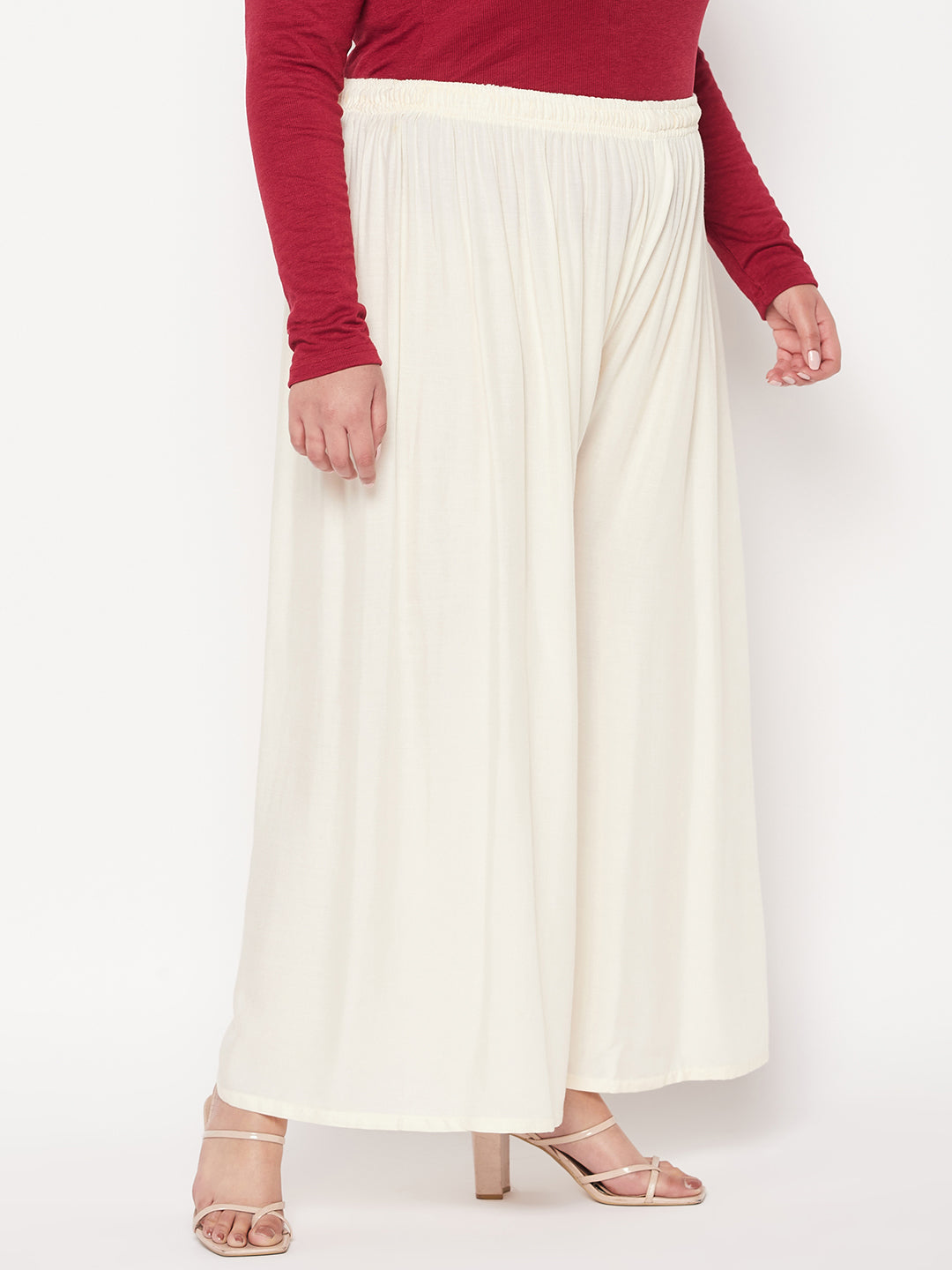 White solid rayon palazzo with elasticated waistband and drawstring.