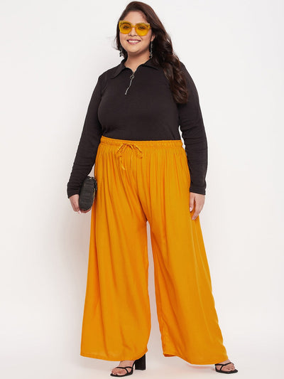 Mustard solid rayon palazzo with elasticated waistband and drawstring.