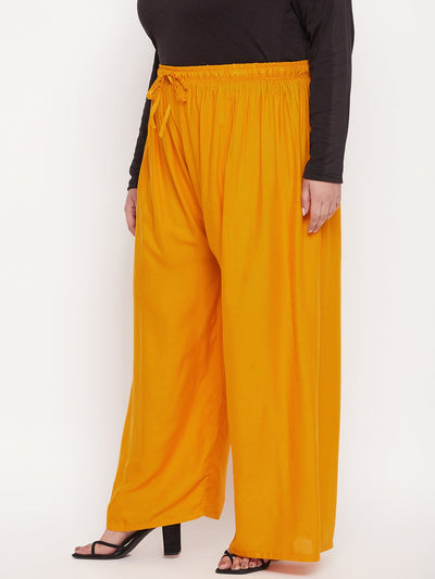 Mustard solid rayon palazzo with elasticated waistband and drawstring.