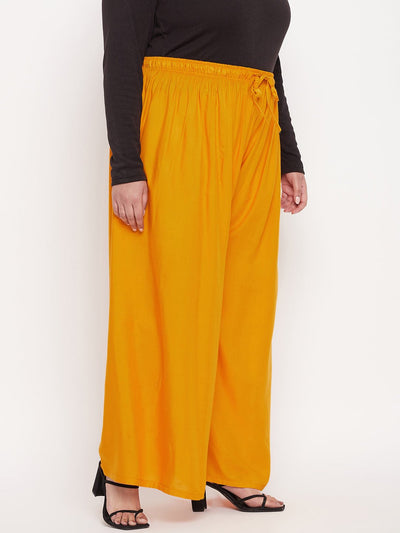 Mustard solid rayon palazzo with elasticated waistband and drawstring.