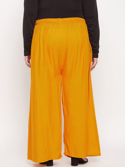 Mustard solid rayon palazzo with elasticated waistband and drawstring.