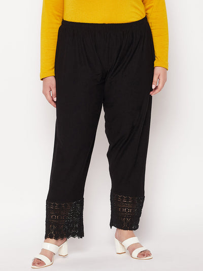 Black solid lace palazzo with elasticated waistband and drawstring.