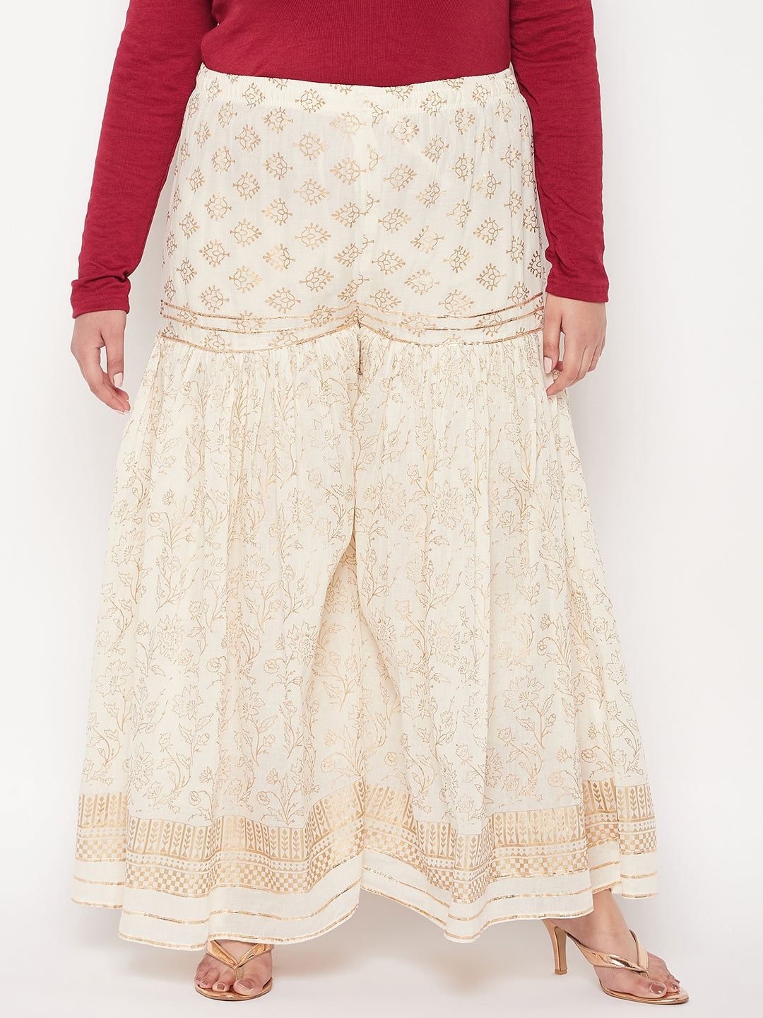 Off-white printed cotton flared gharara with elasticated waistband and drawstring.