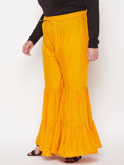 Mustard solid rayon flared gharara with elasticated waistband and drawstring.