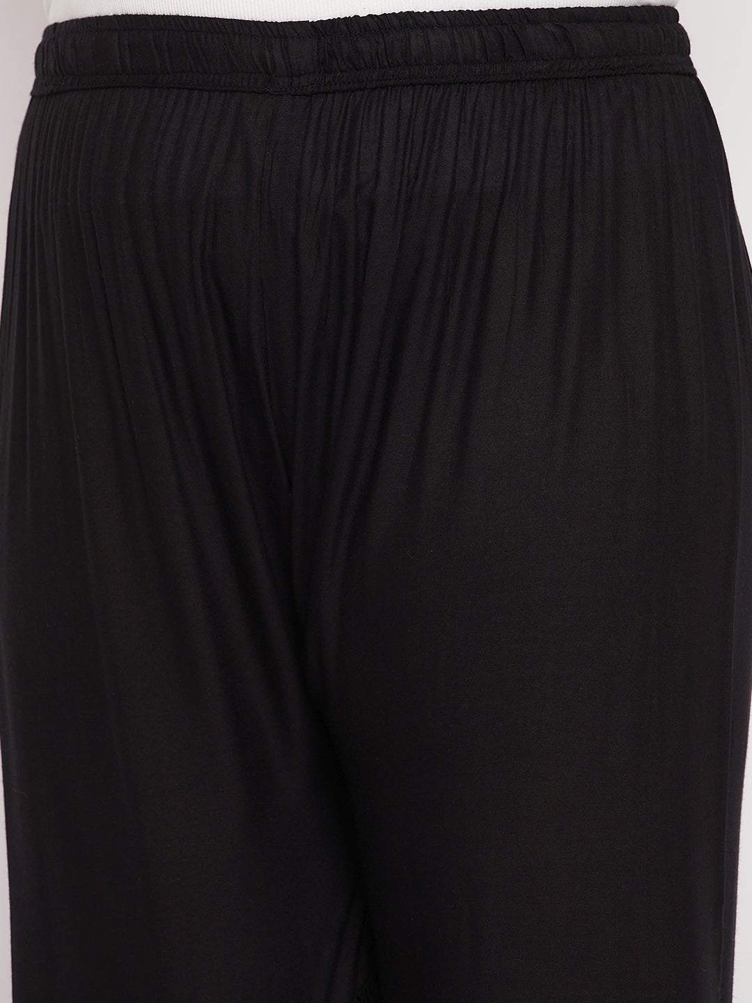 Black solid rayon flared gharara with elastic waistband and drawstring.
