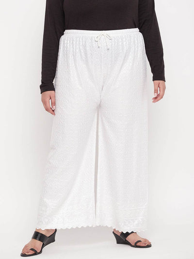White embroidered rayon palazzo with elasticated waistband and drawstring.