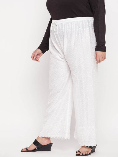 White embroidered rayon palazzo with elasticated waistband and drawstring.
