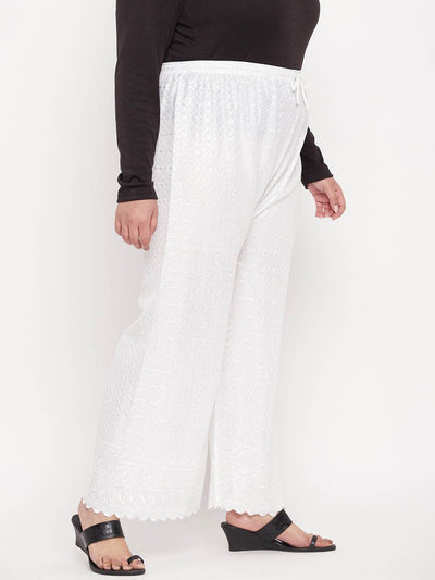 White embroidered rayon palazzo with elasticated waistband.