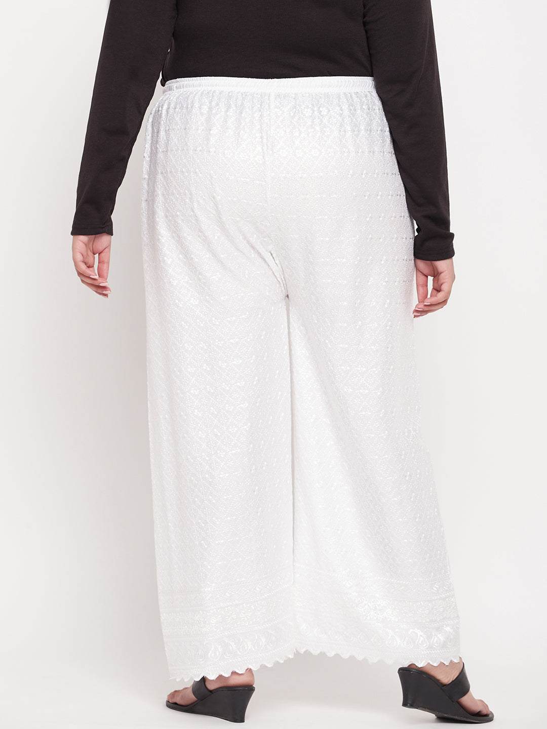 White embroidered rayon palazzo with elasticated waistband and drawstring.
