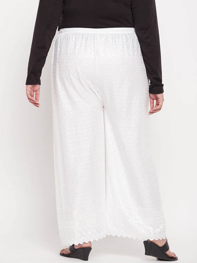 White embroidered rayon palazzo with elasticated waistband and drawstring.