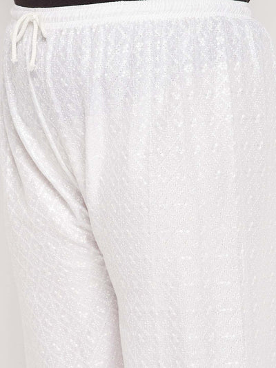 White embroidered rayon palazzo with elasticated waistband and drawstring.