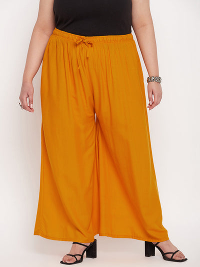 Mustard Solid Rayon Jumbo Sharara with elasticated waistband and drawstring.
