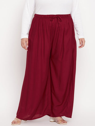 Maroon solid rayon jumbo sharara with elasticated waistband and drawstring.
