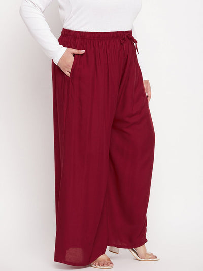 Maroon solid rayon jumbo sharara with elastic waistband and drawstring.