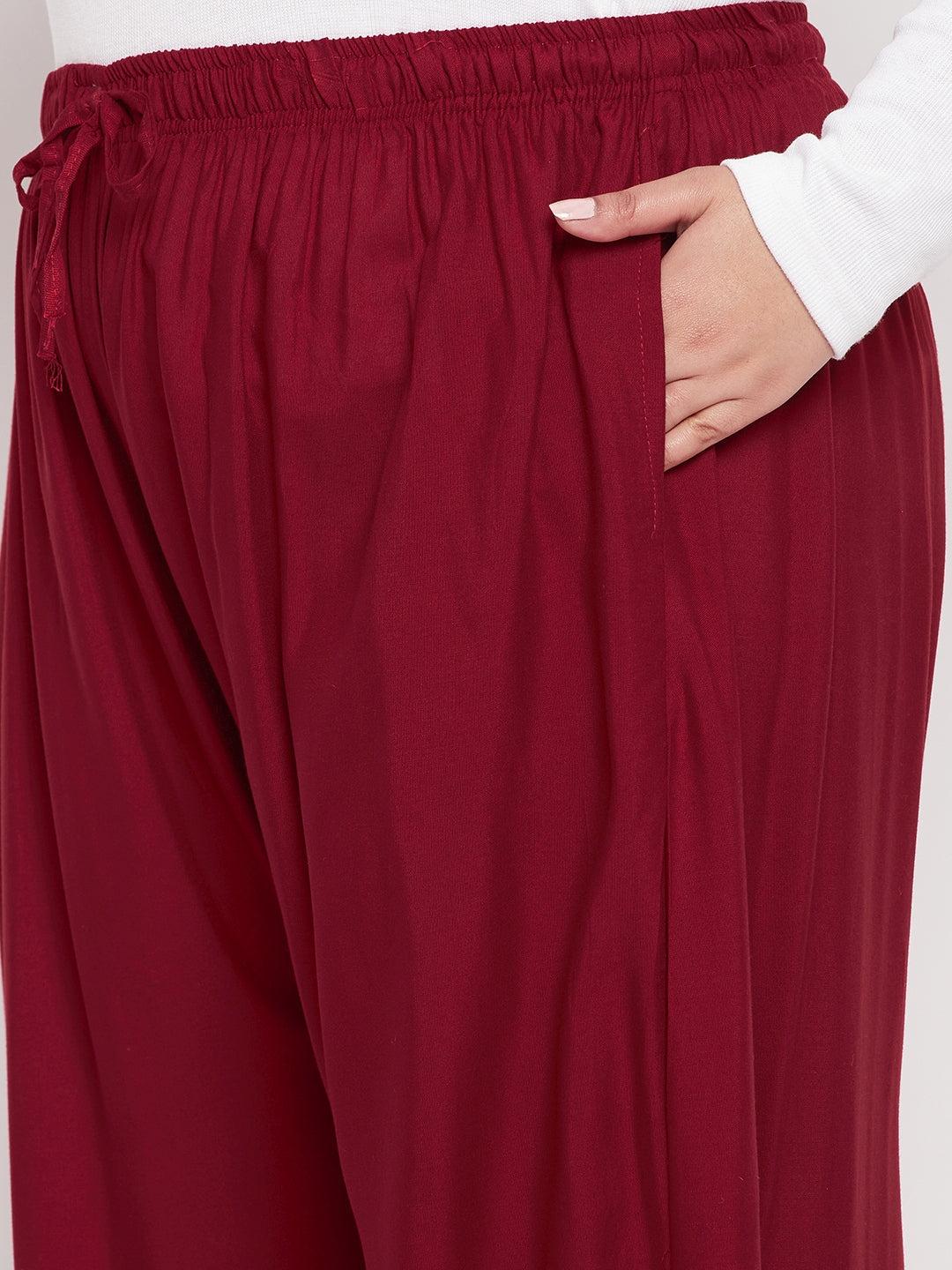 Maroon solid rayon jumbo sharara with elasticated waistband and drawstring.