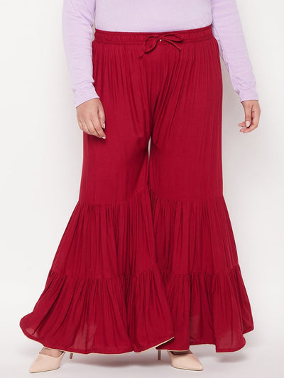 Maroon solid rayon flared gharara with elastic waistband and drawstring.