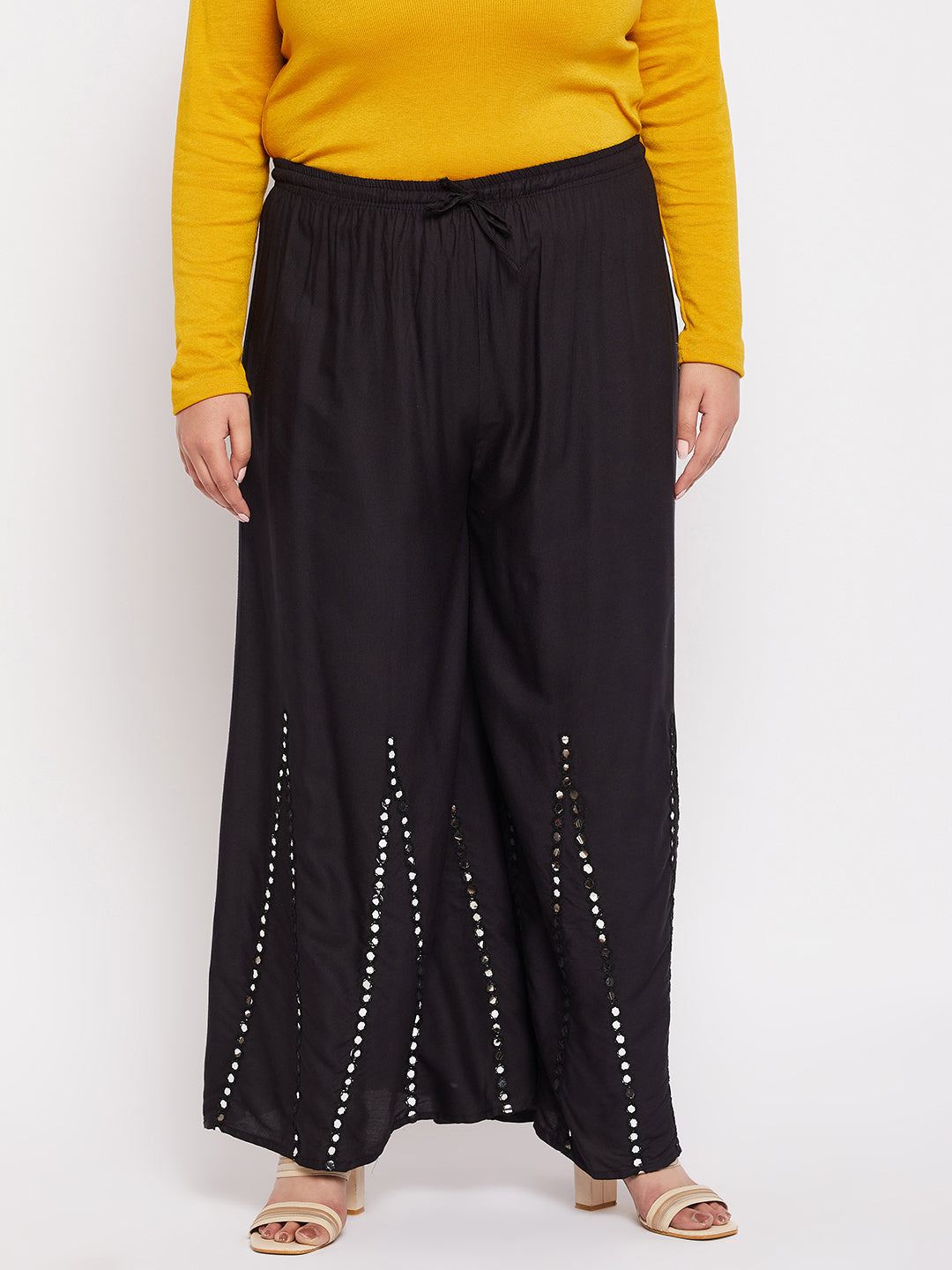 Black rayon sharara with mirror work and elasticated waistband.