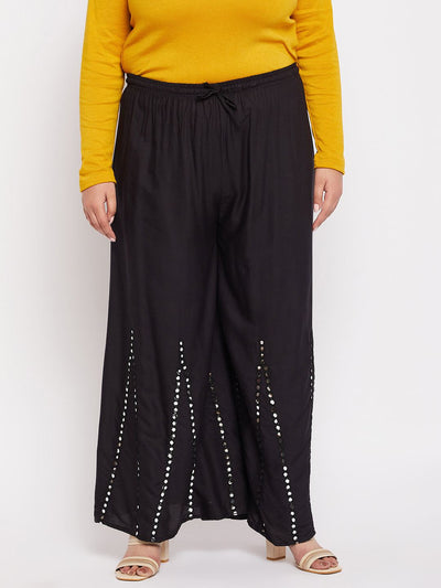 Black rayon sharara with mirror work and elasticated waistband.
