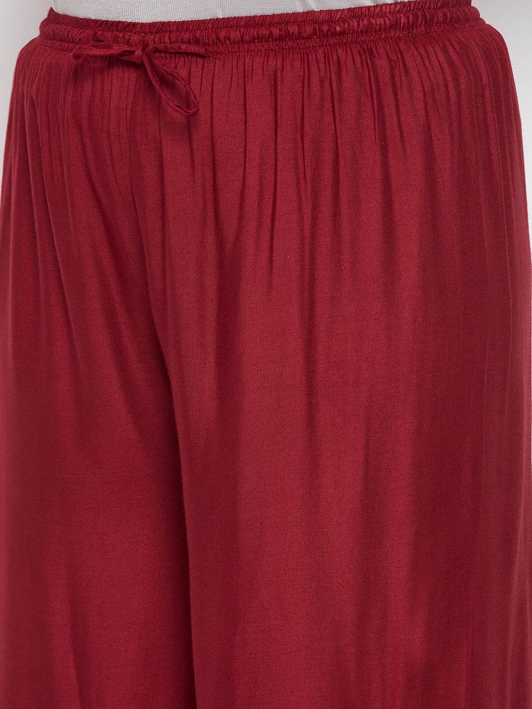 Maroon mirror work rayon sharara with elasticated waistband and drawstring.