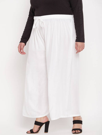 White solid rayon palazzo with elasticated waistband and drawstring.