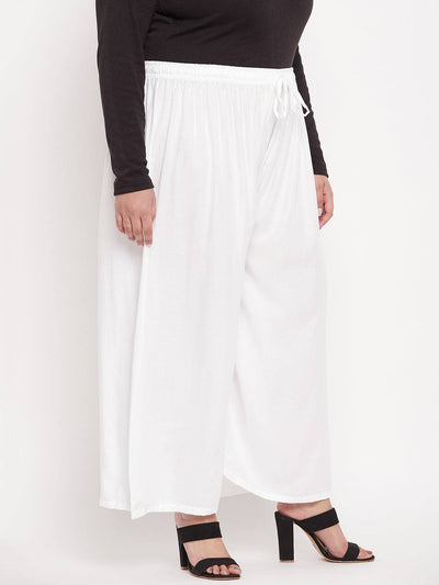White solid rayon palazzo with elasticated waistband and drawstring.