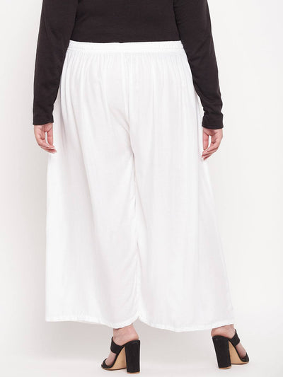 White solid rayon palazzo with elasticated waistband and drawstring.