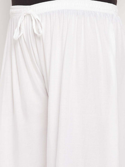 White solid rayon palazzo with elasticated waistband and drawstring.