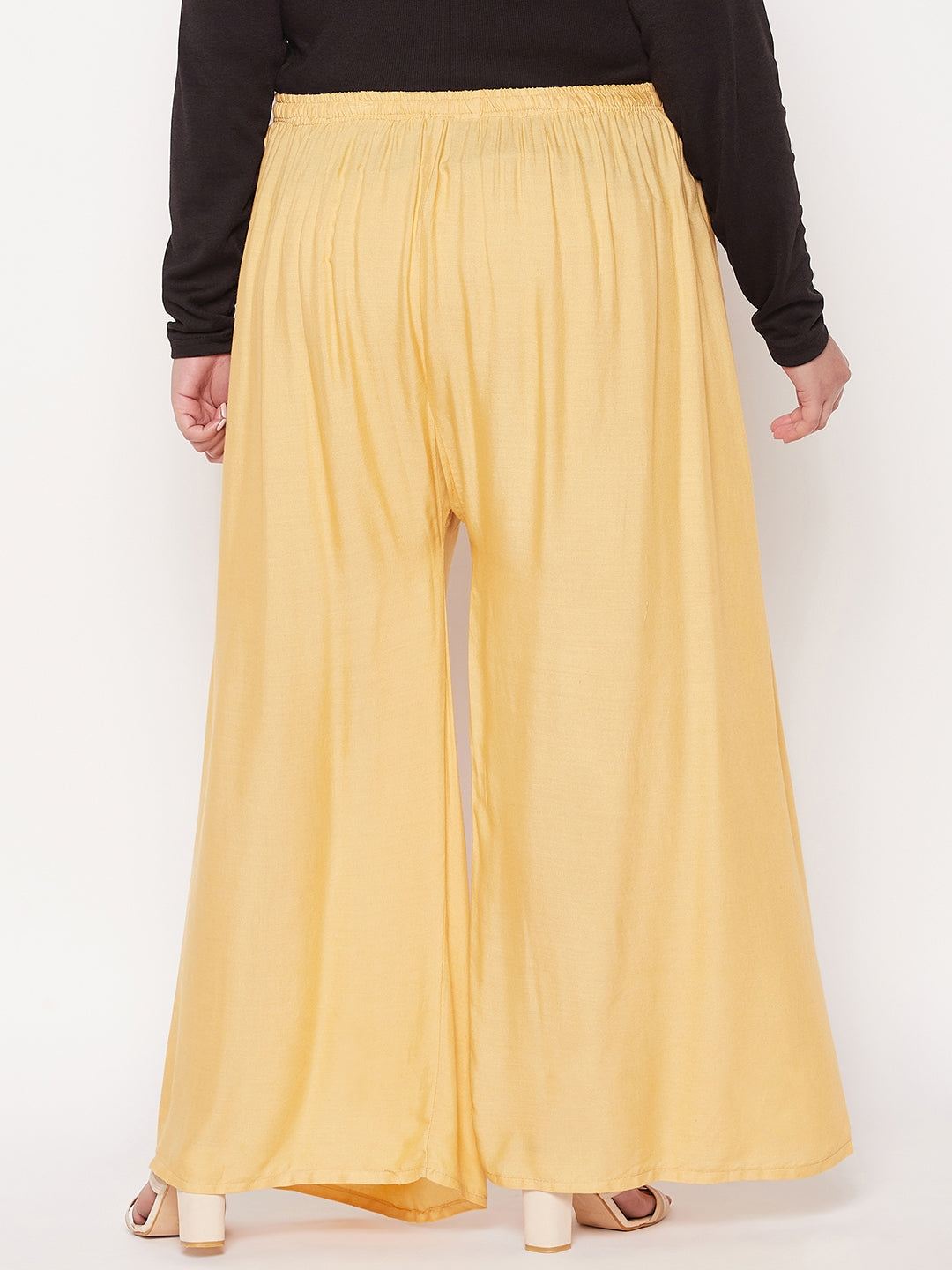 Fawn solid rayon palazzo with elastic waistband and drawstring.