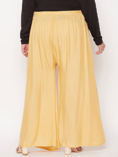 Fawn solid rayon palazzo with elastic waistband and drawstring.