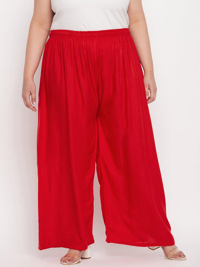 Red solid rayon palazzo with elasticated waistband and drawstring.