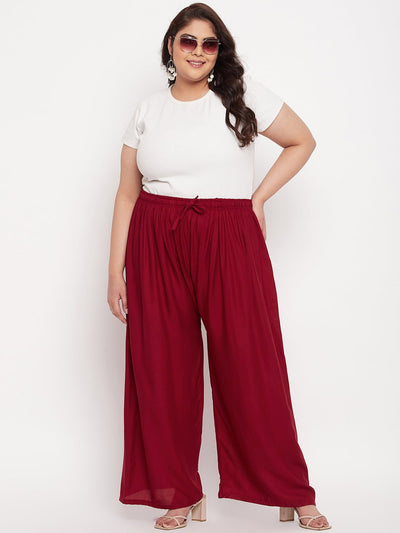 Maroon solid rayon palazzo with elasticated waistband and drawstring.