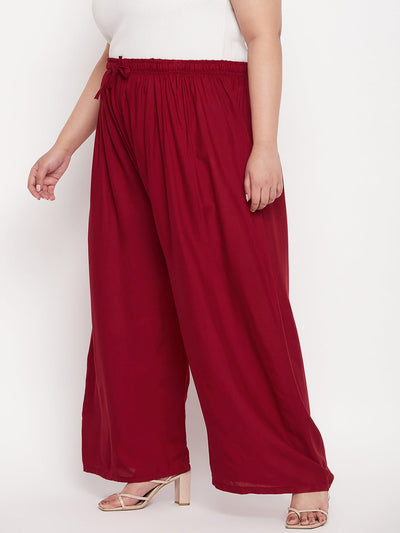 Maroon solid rayon palazzo with elasticated waistband and drawstring.