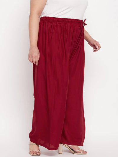 Maroon solid rayon palazzo with elasticated waistband and drawstring.