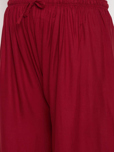 Maroon solid rayon palazzo with elasticated waistband and drawstring.