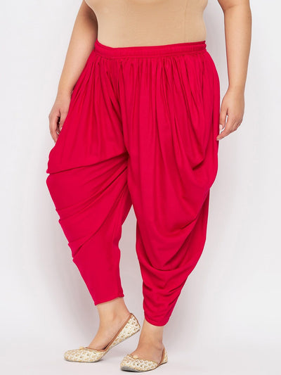 Magenta solid rayon dhoti salwar with elasticated waistband and drawstring.