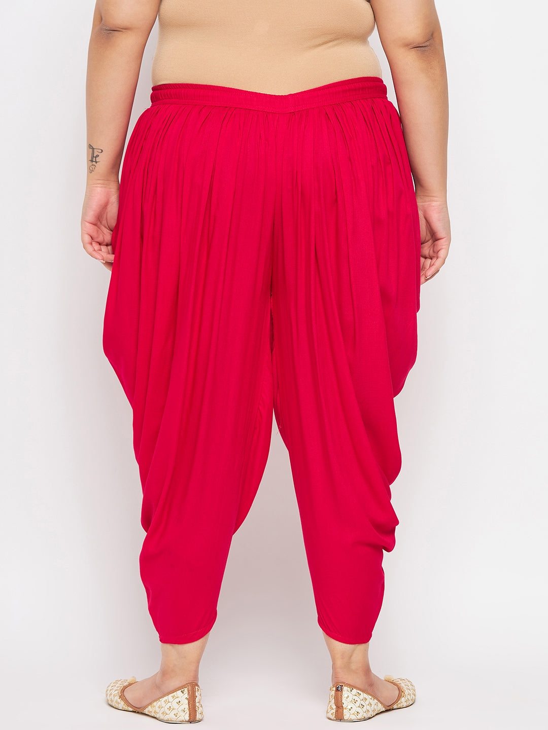 Magenta solid rayon dhoti salwar with elasticated waistband and drawstring.