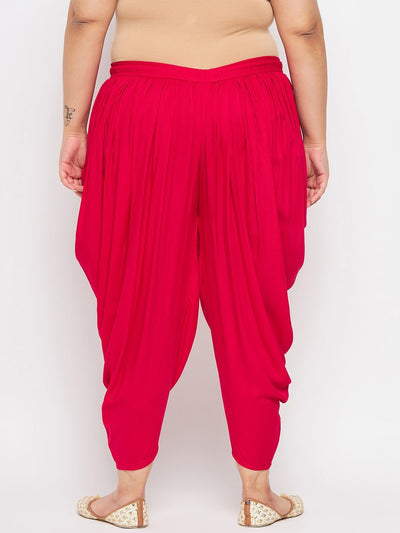 Magenta solid rayon dhoti salwar with elasticated waistband and drawstring.